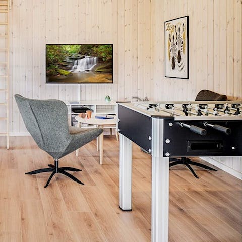 Enjoy a round of foosball, billiards, darts or table tennis in the games room