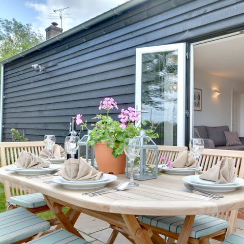 Pull open the French doors and dine alfresco out on the terraced area