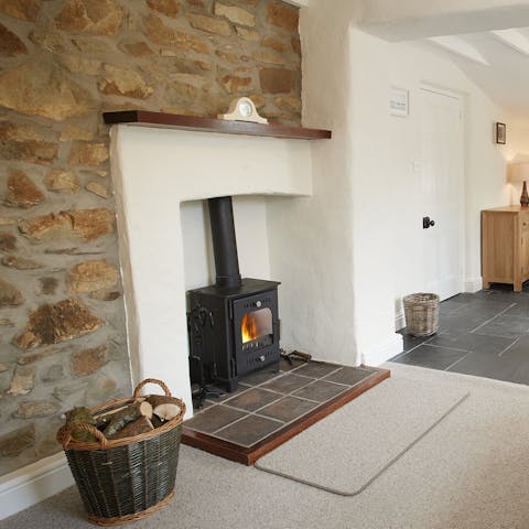 Stretch out in front of the wood burner after a day spent hiking