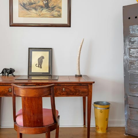 Work from home at the antique desk in the living area