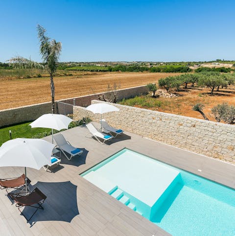 Beat the heat in the private pool with shallow area for little ones