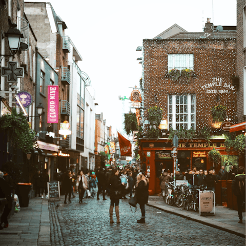 Explore the cobbled streets of Temple Bar just across the river