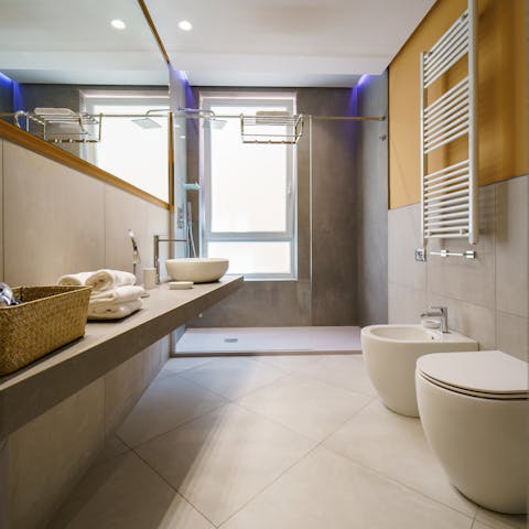 Start the day with a relaxing soak beneath the rainfall shower