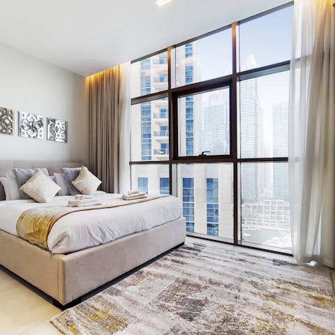 Open the curtains each morning to let the light in through floor-to-ceiling windows