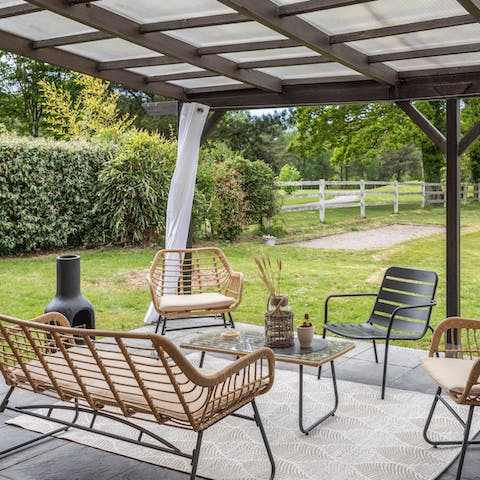 Sit out on the terrace as the sun goes down and light up the chiminea