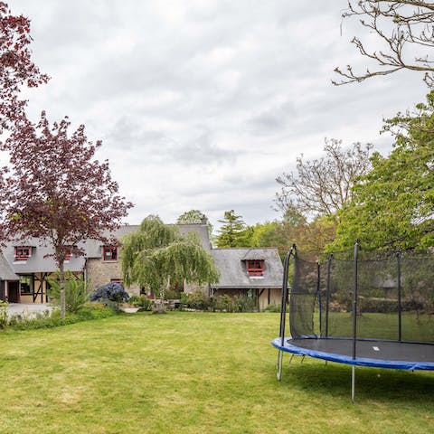 Let little ones loose on the trampoline and play equipment