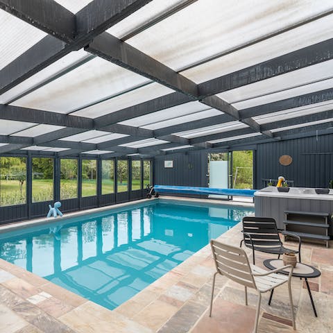 Flit between the heated swimming pool and Jacuzzi in the wellness space
