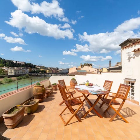Enjoy an alfresco meal and a spritz on the private terrace overlooking the river