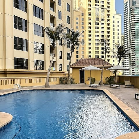 Swim in the communal pool to escape the Dubai heat