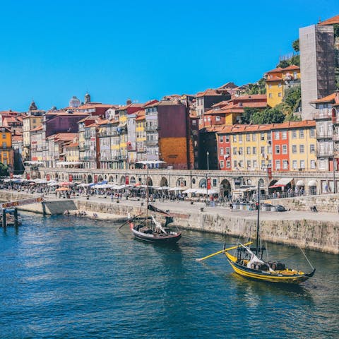 Sip a glass of Port and watch the boats drift by at Cais da Ribeira, reached in twenty minutes by foot