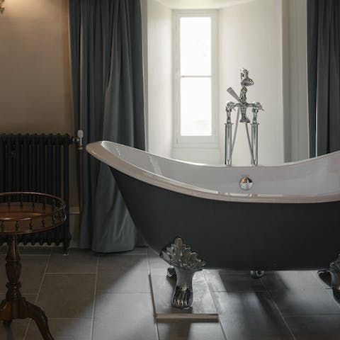 Relax with a long bubbly soak in the roll-top bathtub