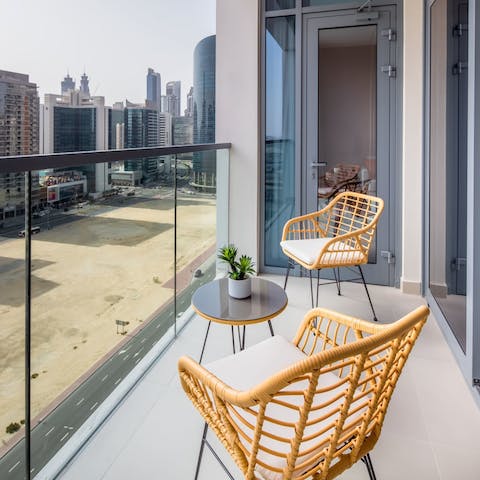 Enjoy a peaceful coffee out on the apartment's private balcony
