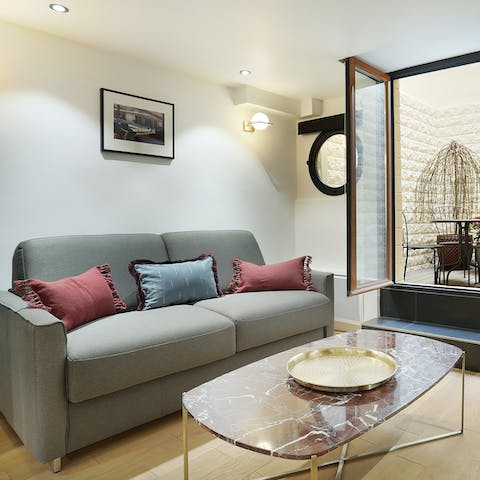 Sink into the inviting sofa at the end of a long day in the city