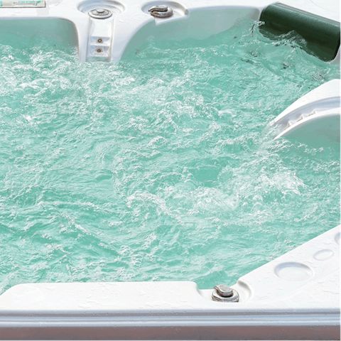 Relax with a cold drink in the hot tub