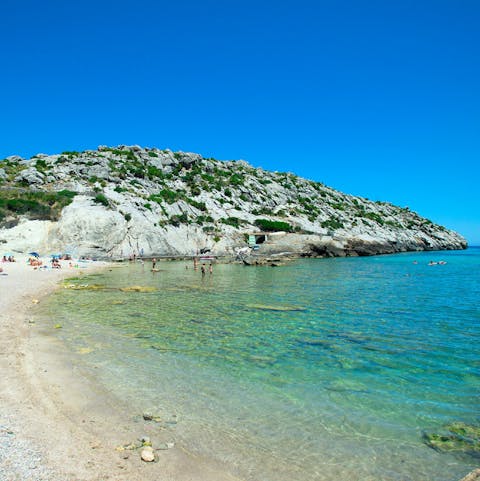 Bathe in the crystal clear waters of nearby Cala San Vicente