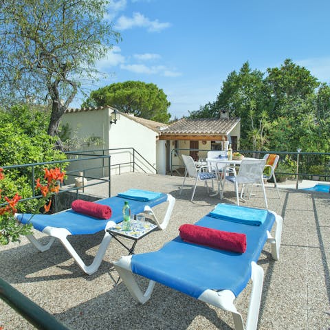Laze on loungers in the sun or cool off with a cocktail on your raised, private terrace