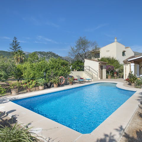 Take the plunge in your private, outdoor pool surrounded by lush Mediterranean vegetation