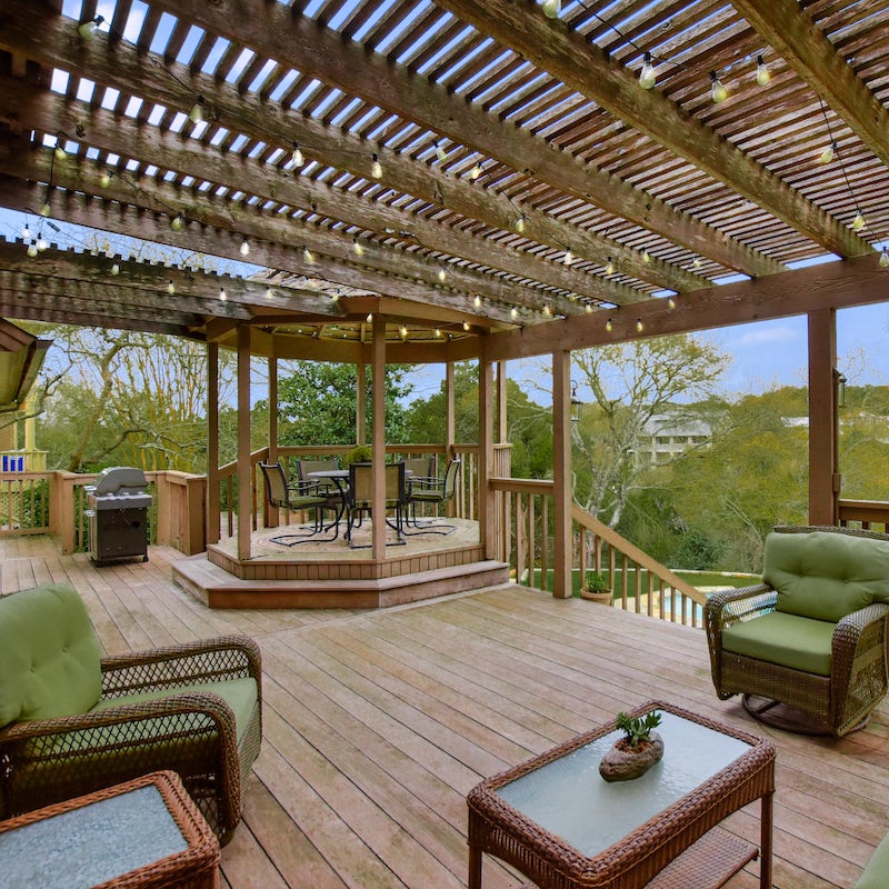 Chill on the seats under the pergola with a burger from the BBQ