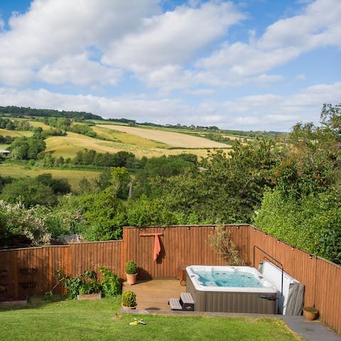 Sit back in the hot tub and unwind as you take in the peaceful surroundings