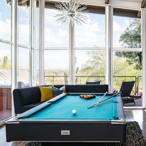 Play pool in the sun-drenched games room