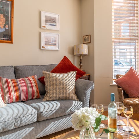 Take a moment to relax with a good book and a glass of wine in the light-filled living space