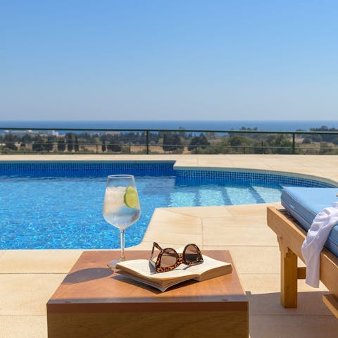 Sip on a fresh drink whilst looking out across the Aegean Sea