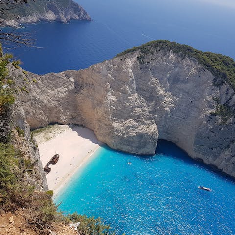 Explore Zakynthos' hidden caves, sparkling blue waters and famous shipwreck beach