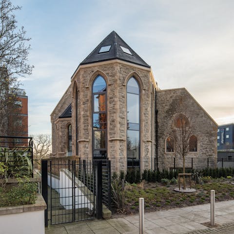 Stay in a converted church with shared outdoor space and pubs nearby
