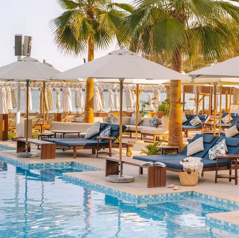 Spend lazy days lounging by the pool with beach bar refreshments on tap