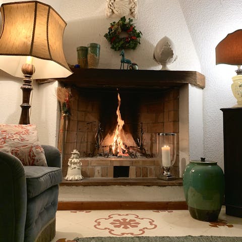 Keep the evening chill at bay with a fire in the traditional living room