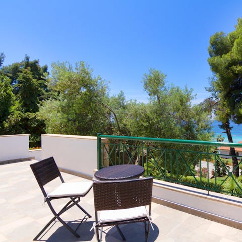 Enjoy a drink on the balcony with sea views