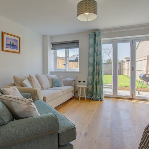 Step right out to the garden from the glass doors in the sunny lounge