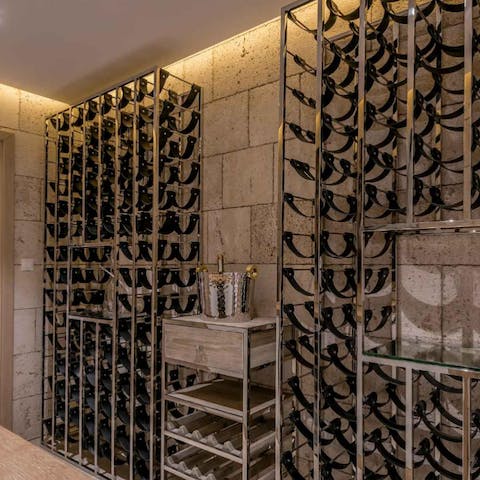 Pour a glass of exceptional wine from the private wine cellar