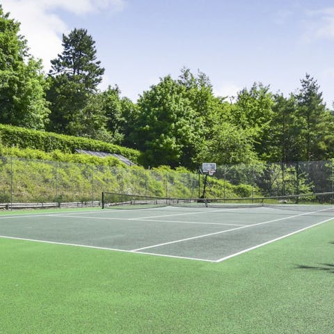 Enjoy an energising game of tennis on the shared court