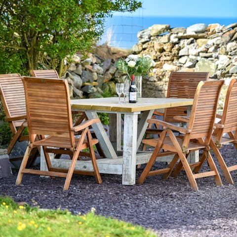 Soak up the last of the afternoon sun in the garden before tucking into barbecue dinners alfresco