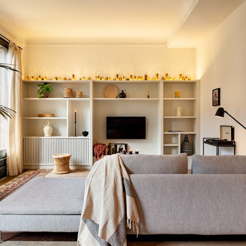 Relax and unwind on the living room's large sofa