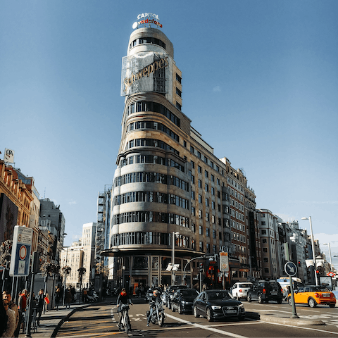 Admire Gran Vía's striking architecture and plethora of shops