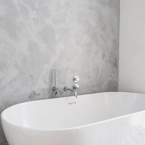 Treat yourself to a long, hot soak in the contemporary tub on cooler evenings