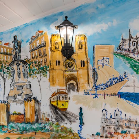 Admire the painted Lisbon murals around this home