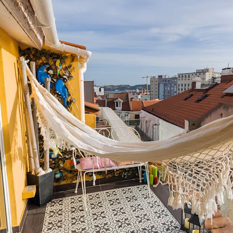 Relax in the Portuguese sun in the hammock on the balcony