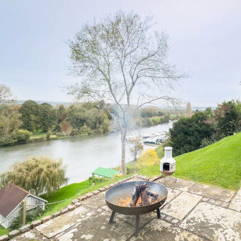Lounge around the fire pit beside the river or hire a boat