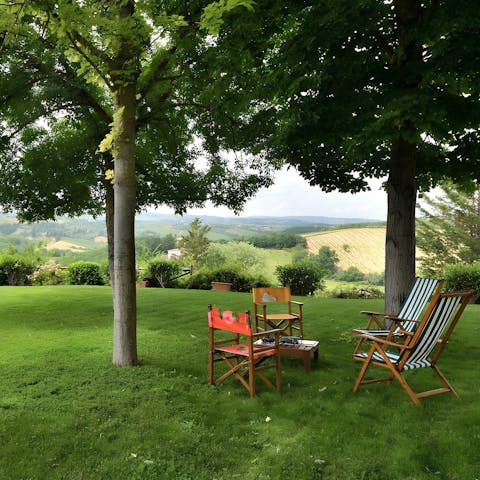 Sit on the deck chairs amongst the leafy trees and enjoy the vistas