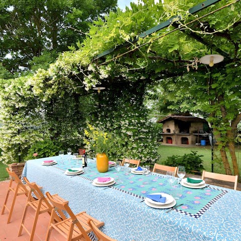 Gather around the dining table on the ivy-covered terrace for alfresco feasts