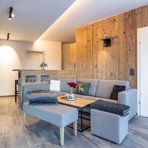 Gather for après-ski drinks on the sofa as the log burner warms your modern living room