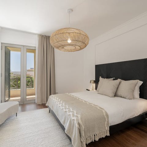 Roll out of the plush double bed and onto your private balcony to greet the day