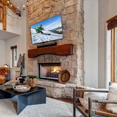 Warm yourself up by the stunning stone fireplace