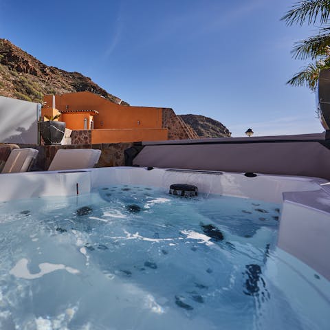 Unwind in the soothing bubbles of the hot tub