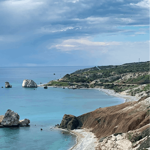 Discover the mountain ranges, sea caves, and hilly fields of Cyprus