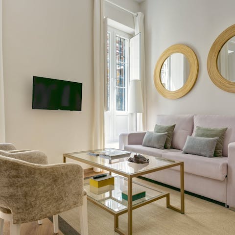 Relax with a glass of Spanish wine in the bright living area