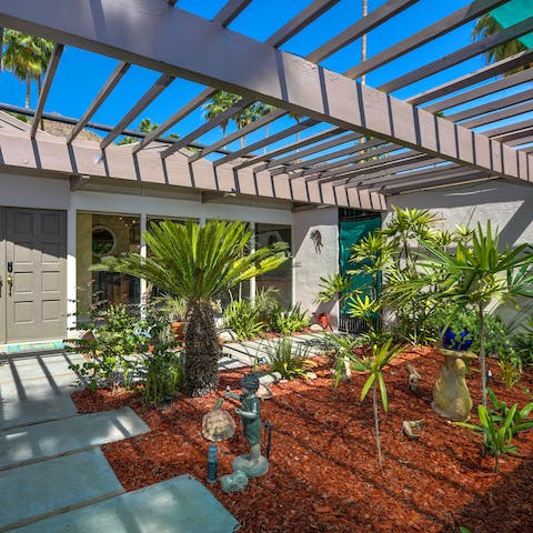 Admire the mid-century styling and the pretty atrium